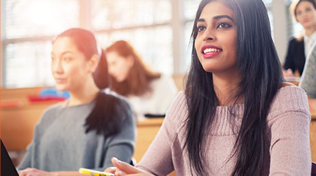 Young female college students in a classroom