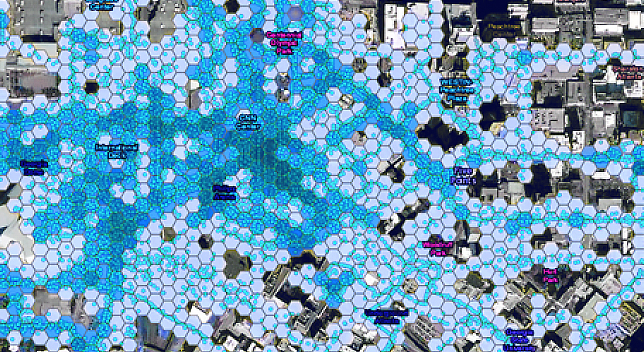 Mapa de uma cidade com hexágonos sobrepostos em vários tons de azul 