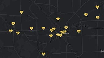 Um mapa escuro marcado com vários ícones de coração amarelo