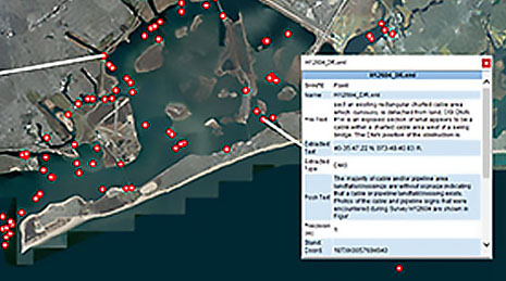 Satellite image with scattered red dots for data points on gray colored land