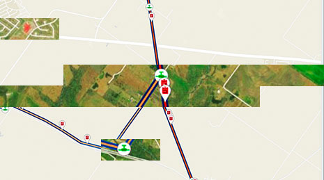 Aerial image of green land with lines and symbols representing pipeline route data