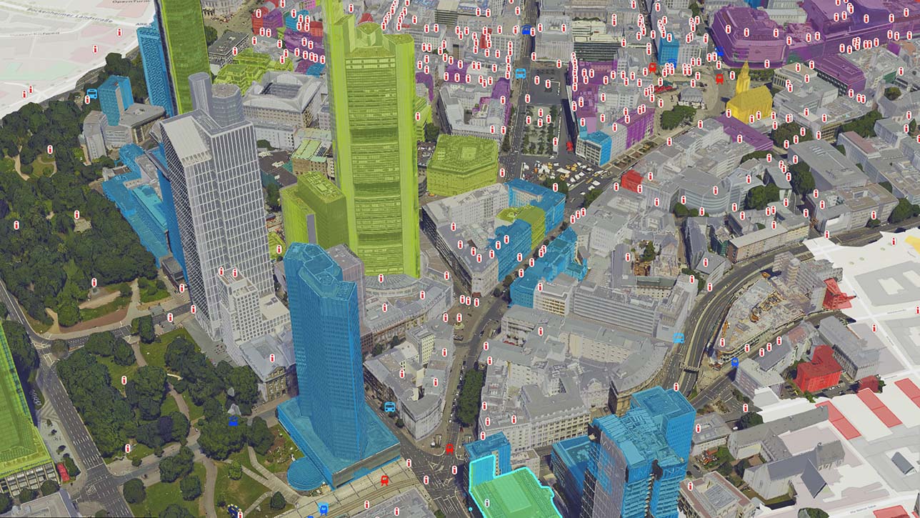 A colorful digital representation of a city representing a 3D mesh with data and buildings colored in green and blue 