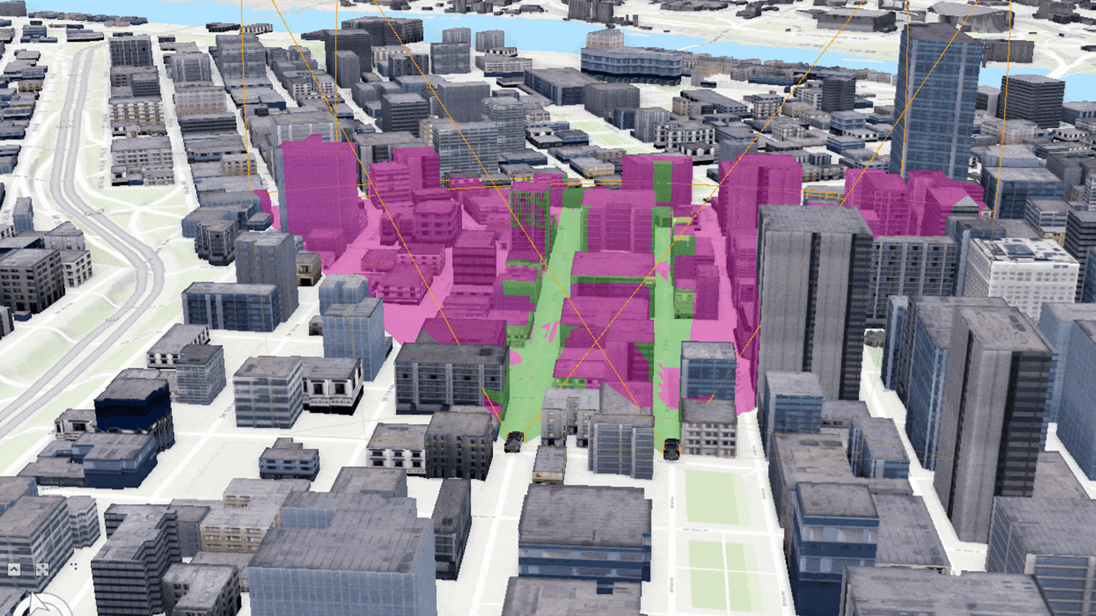 Um modelo 3D do centro de uma cidade. Vários edifícios são destacados em tons de rosa e verde, indicando zonas ou áreas de interesse dentro da cidade.